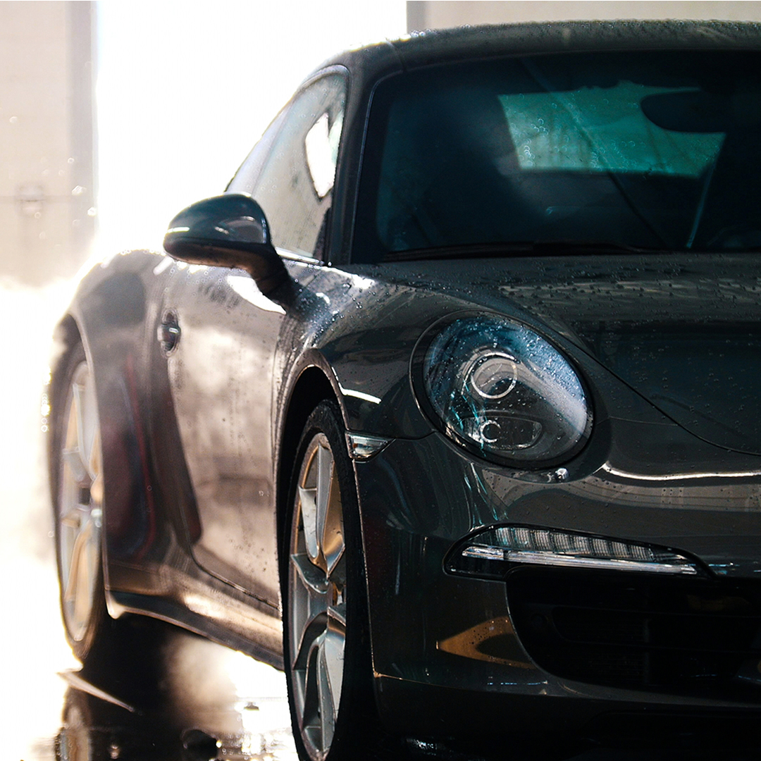 shiny sports car coming out of car wash